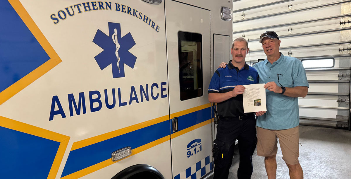Paramedic Kevin Brown being thanked for helping to save a life.